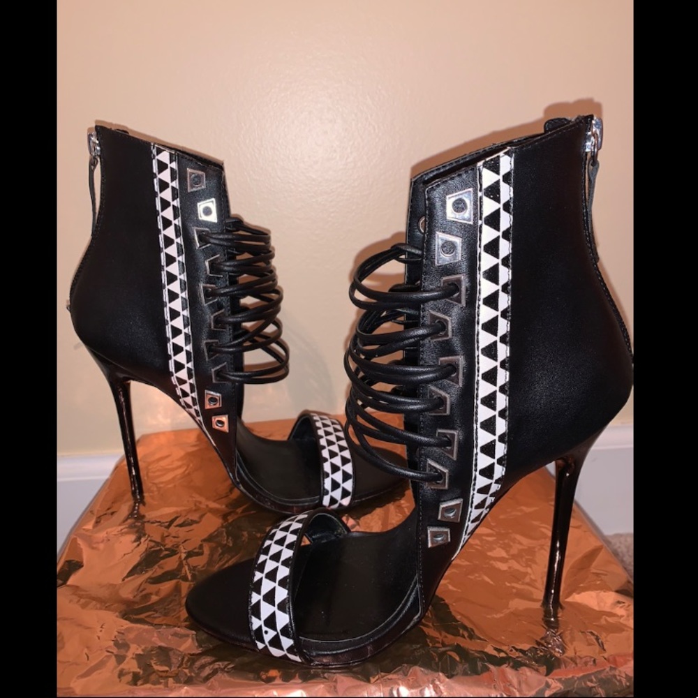 Black and white laced up stilettos